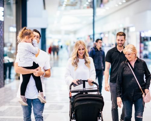 robina-town-centre-couple-with-father-carrying-daughter-with-pram.